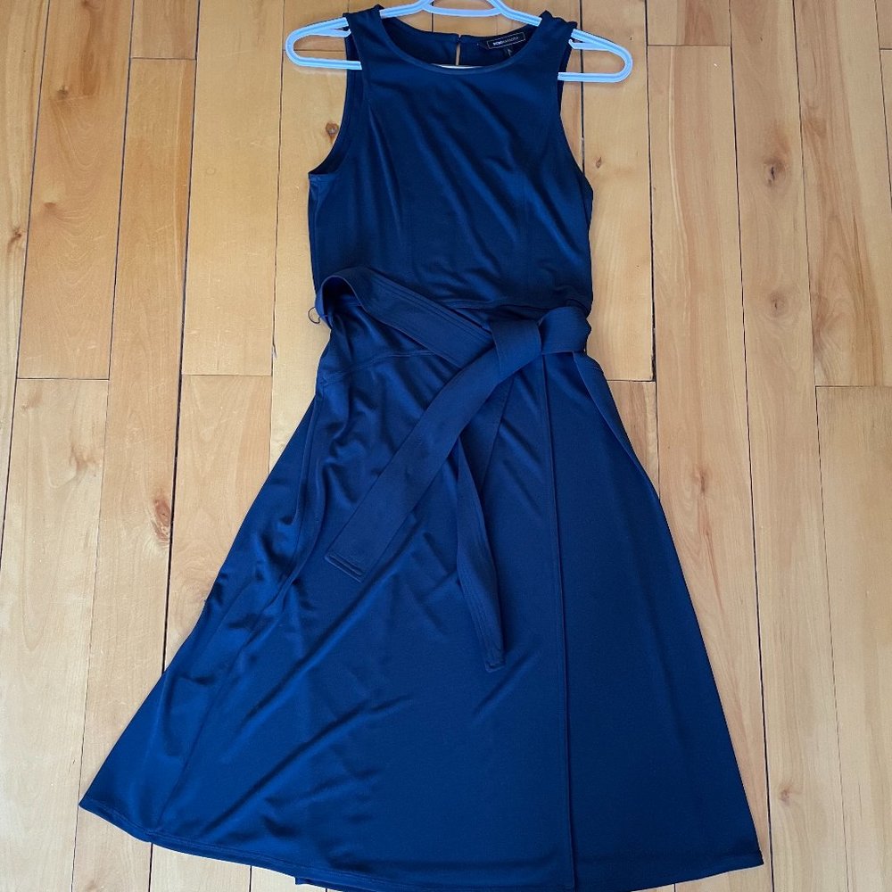 BCBG Maxazria faux wrap midi dress in navy. Size small.